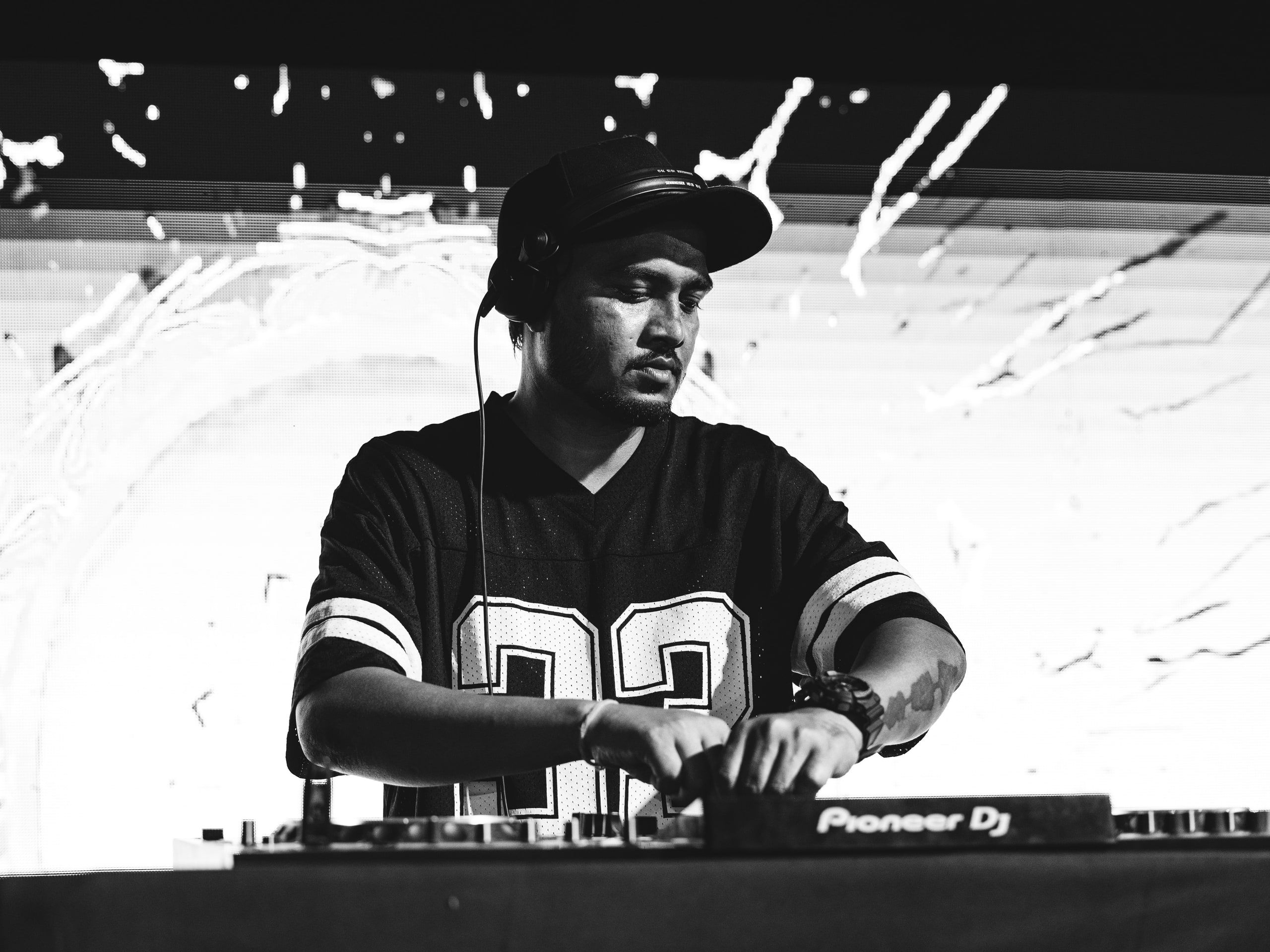 Black and white close-up of a DJ mixing